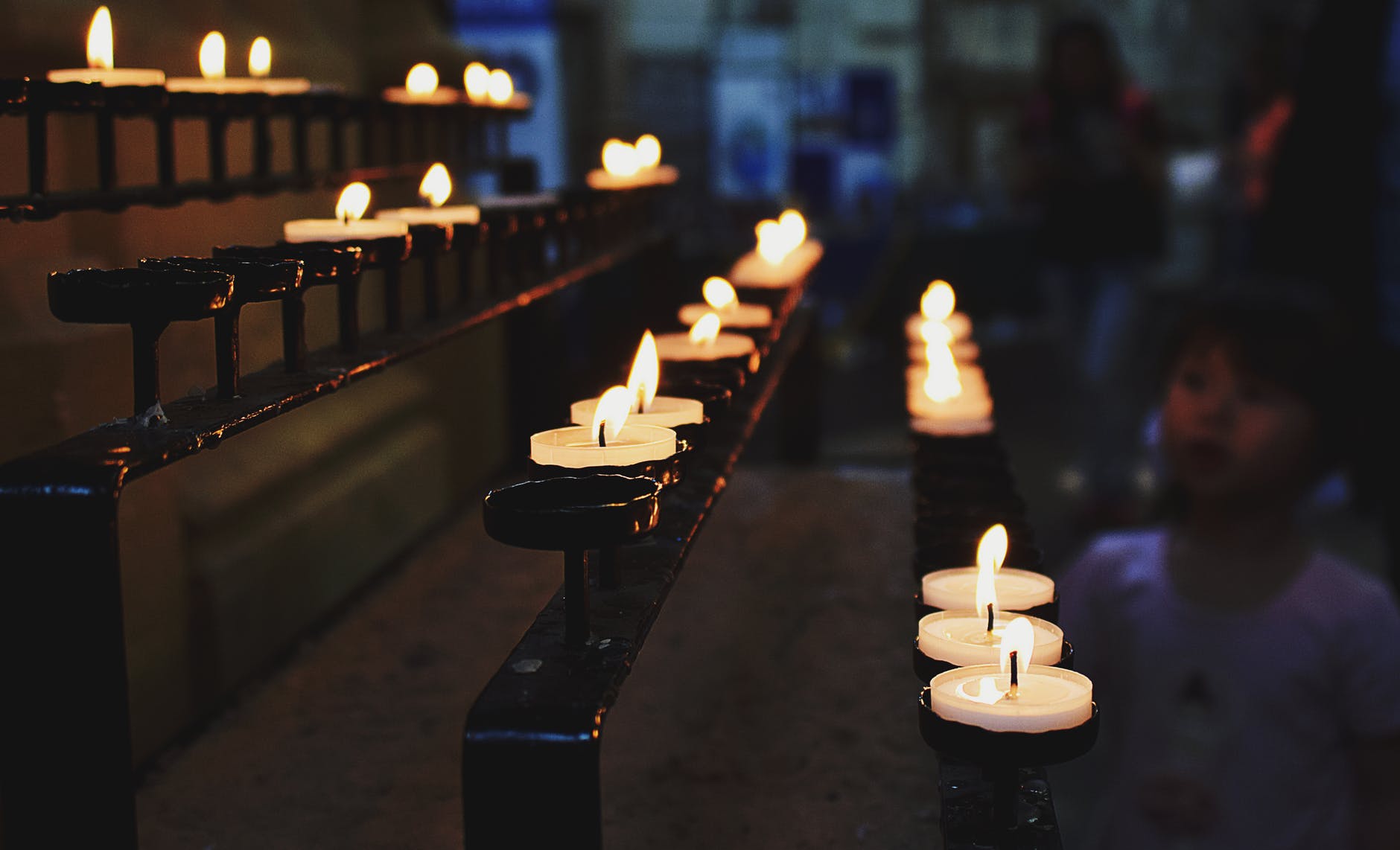 white tealight candles lit during nighttime